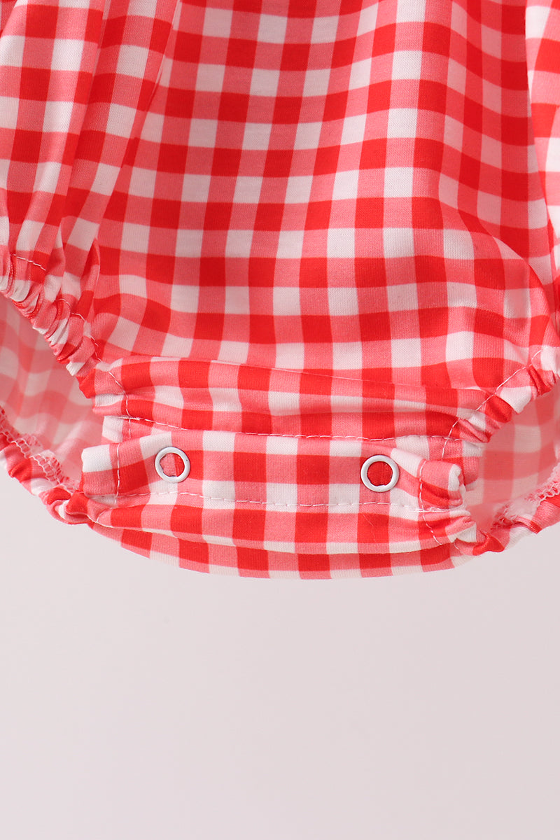 Burbuja bordada de cuadros rojos con personaje