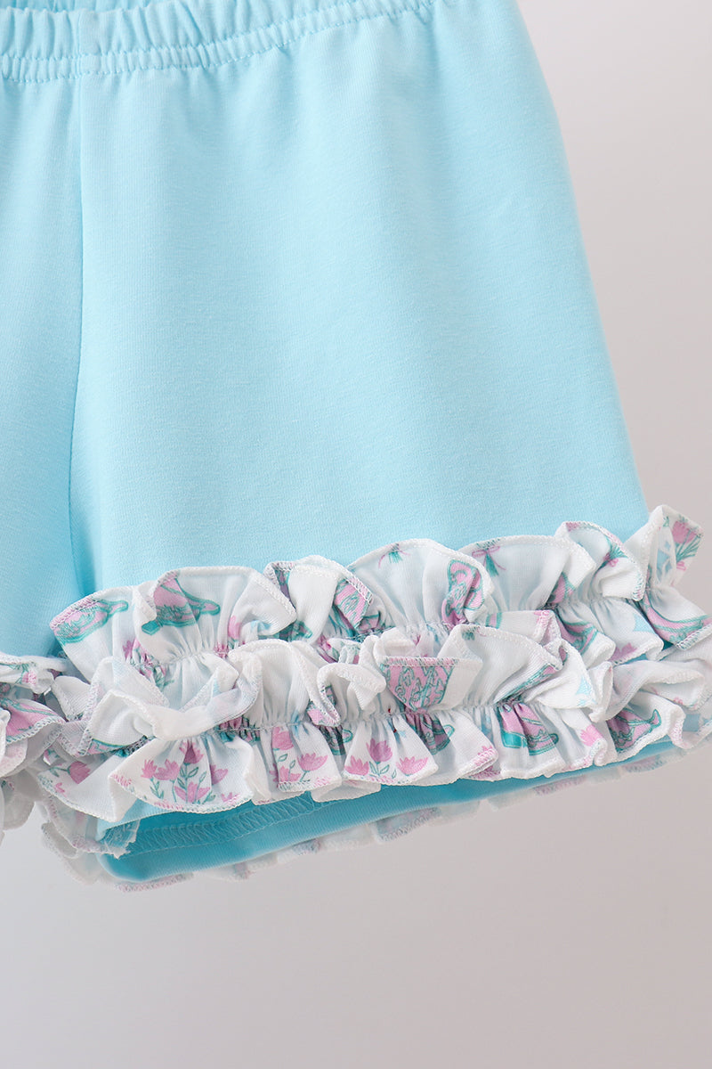 Conjunto de shorts con volantes y botas azules